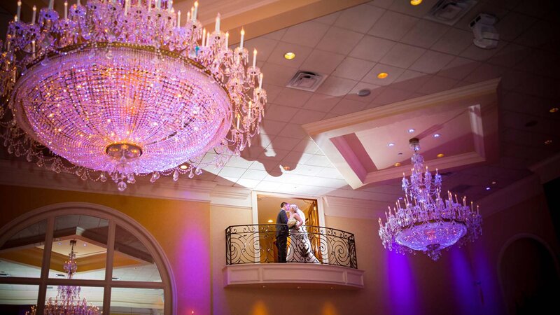 Wedding couple on balcony.