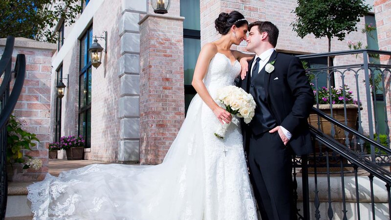 Bride and groom looking at each other outside.